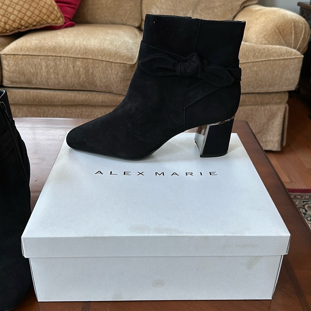 I'm selling black suede ankle boots. never worn.wear them with jeans or skirts.